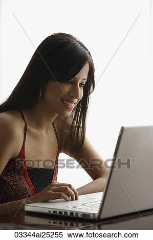 Stock Photography - woman at laptop. Fotosearch