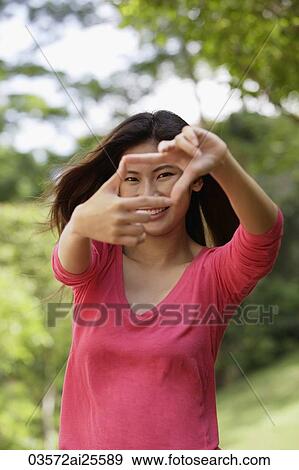 Stock Photo - Woman making hand gesture. Fotosearch