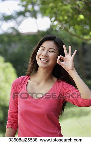 Woman making the "O. K. " sign View Large Photo Image Stock Photo - Woman making the "O. K. " sign. Fotosearch