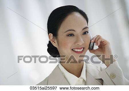Stock Photo - Woman on cell phone. Fotosearch