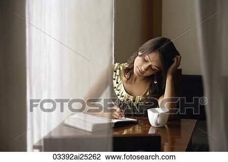 woman with notebook, cup of coffee View Large Photo Image Stock Image - woman with notebook, cup of coffee. Fotosearch