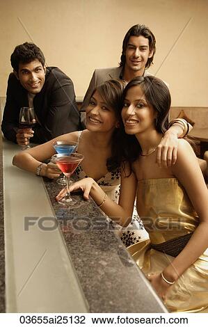 Stock Image - young adults at a bar. Fotosearch