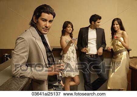 Stock Photo - young adults at a bar. Fotosearch
