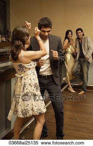 Stock Photography - young adults at a bar. Fotosearch
