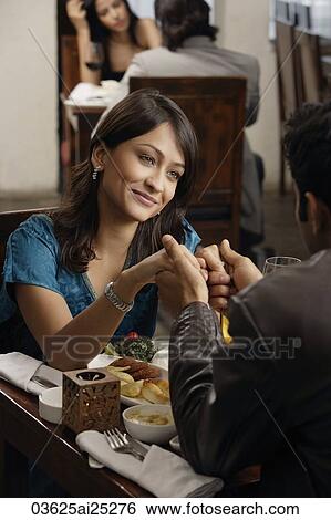 young couple at restaurant View Large Photo Image Stock Photograph - young couple at restaurant. Fotosearch