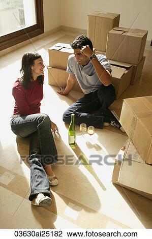 Young couple in new home View Large Photo Image Stock Image - Young couple in new home. Fotosearch