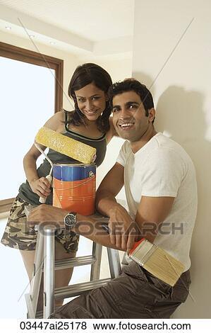 Stock Photo - Young couple painting. Fotosearch