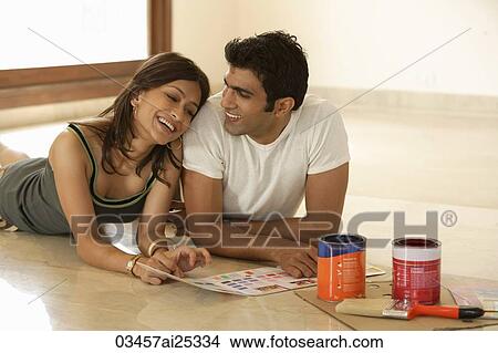 young couple preparing to paint View Large Photo Image Picture - young couple preparing to paint. Fotosearch