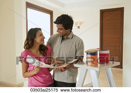 Young couple with paint supplies View Large Photo Image Stock Photography - Young couple with paint supplies. Fotosearch