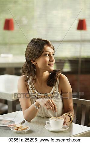 young woman with cup of coffee View Large Photo Image Stock Photography - young woman with cup of coffee. Fotosearch