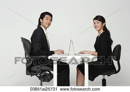 Stock Image - business colleagues working at computers. Fotosearch