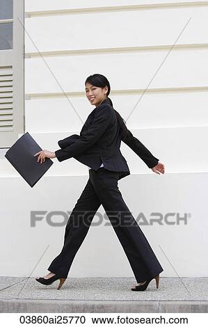 Business woman walking View Large Photo Image Stock Image - Business woman walking. Fotosearch