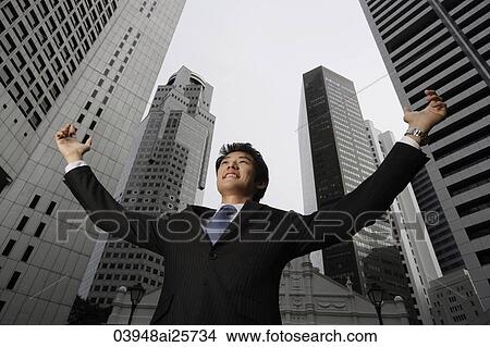 Businessman raising arms in air View Large Photo Image Picture - Businessman raising arms in air. Fotosearch