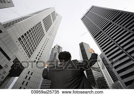 Businessman raising arms in air View Large Photo Image Stock Photography - Businessman raising arms in air. Fotosearch