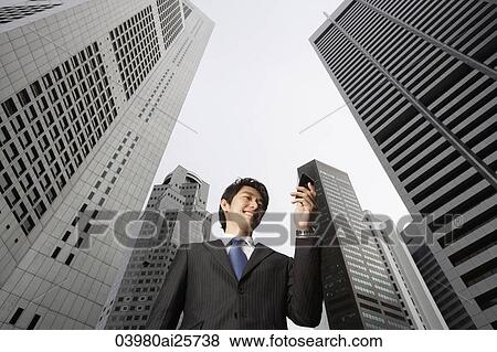 Businessman reading messages View Large Photo Image Stock Photo - Businessman reading messages. Fotosearch