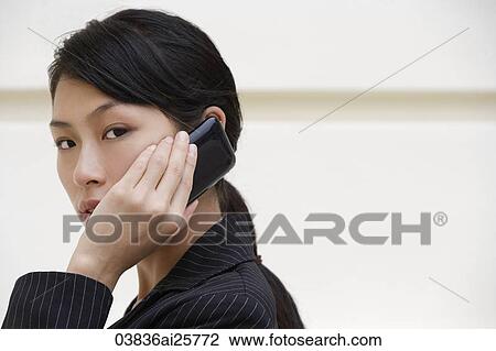 Businesswoman on mobile phone View Large Photo Image Stock Image - Businesswoman on mobile phone. Fotosearch