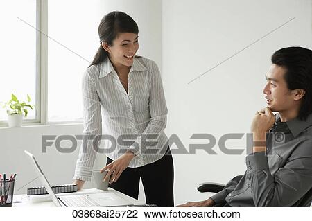 Colleagues discussing View Large Photo Image Stock Image - Colleagues discussing. Fotosearch