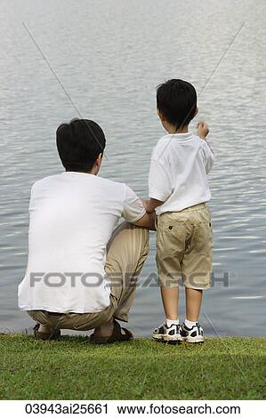 Father and son looking at lake View Large Photo Image Stock Image - Father and son looking at lake. Fotosearch