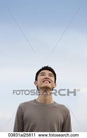 Stock Image - Man looking up. Fotosearch