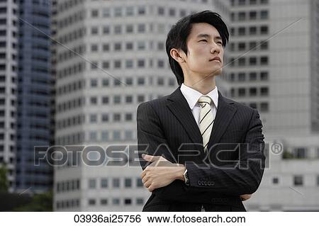 Portrait of businessman with arms crossed View Large Photo Image Stock Photograph - Portrait of businessman with arms crossed. Fotosearch
