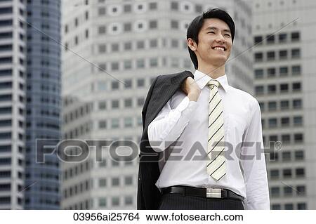 Portrait of businessman with jacket over shoulder View Large Photo Image Picture - Portrait of businessman with jacket over shoulder. Fotosearch