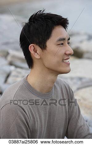Profile of man sitting on seashore View Large Photo Image Stock Photograph - Profile of man sitting on seashore. Fotosearch