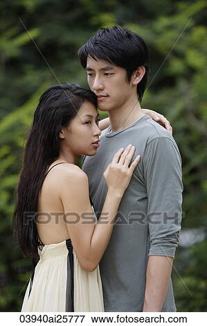 Stock Photo - Young couple embracing. Fotosearch