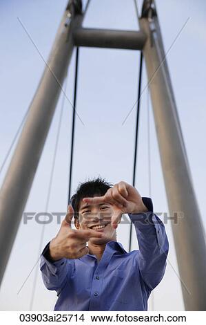 young man framing picture with fingers View Large Photo Image Picture - young man framing picture with fingers. Fotosearch