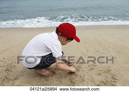 boy playing on beach View Large Photo Image Picture - boy playing on beach. Fotosearch