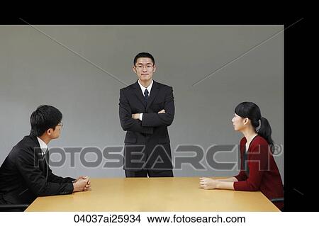 Picture - Business associates in conference room. Fotosearch