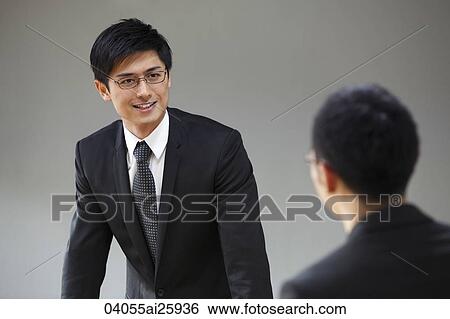Stock Photograph - Business associates in meeting. Fotosearch
