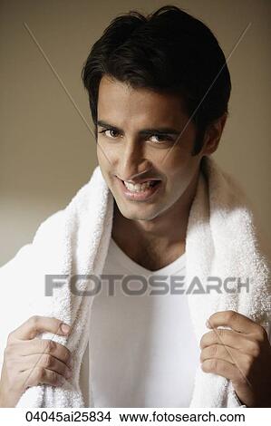 Picture - Man smiling with towel around neck. Fotosearch