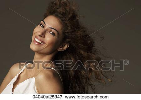 Stock Photo - Portrait of woman with windblown hair. Fotosearch