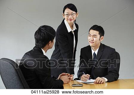 Three colleagues meeting in conference room View Large Photo Image Stock Photo - Three colleagues meeting in conference room. Fotosearch