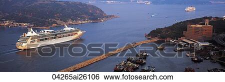 Stock Photograph - A cruise ship passes the Lei Yu Mun channel, the entrance of Victoria Harbour, Hong Kong. Fotosearch