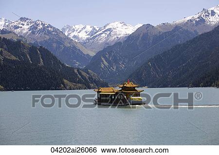 An excusrion boat on Tianshan Lake (Lake of Heaven), Wulumuqi, Xinjiang, China View Large Photo Image Stock Photograph - An excusrion boat on Tianshan Lake (Lake of Heaven), Wulumuqi, Xinjiang, China. Fotosearch