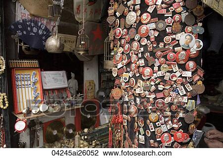 Stock Image - Chairman Mao badges displaying in a souvenir shop, Yuyuan, Shanghai, China. Fotosearch