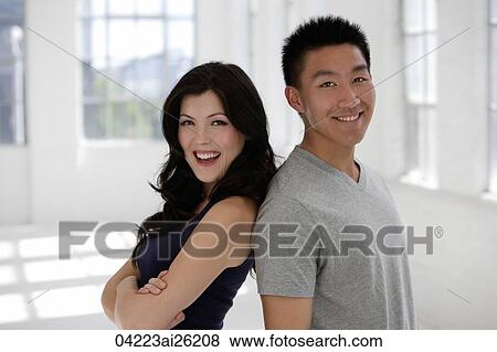 Couple leaning on each other, smiling View Large Photo Image Stock Photo - Couple leaning on each other, smiling. Fotosearch