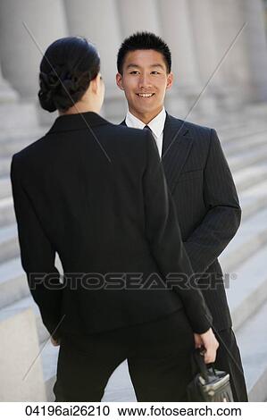 Executives talking outside office View Large Photo Image Stock Image - Executives talking outside office. Fotosearch