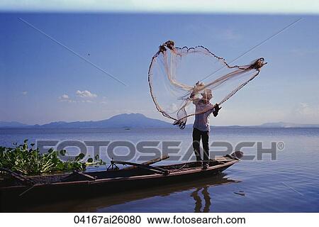 Stock Image - Fisherman fishing at Majayjay Rizal, Philippines. Fotosearch