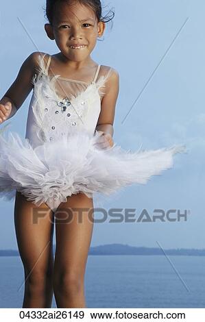 Girl jumping in air wearing tutu. View Large Photo Image Stock Photo - Girl jumping in air wearing tutu.. Fotosearch