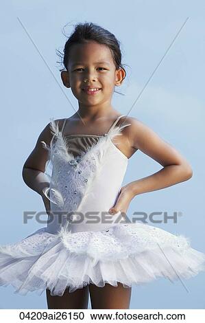 Girl smiling at camera wearing tutu. View Large Photo Image Stock Image - Girl smiling at camera wearing tutu.. Fotosearch