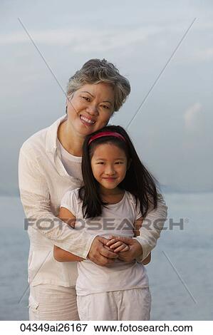 Grandma hugging little girl. View Large Photo Image Stock Photo - Grandma hugging little girl.. Fotosearch