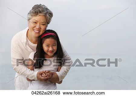 Grandma hugging young girl. View Large Photo Image Stock Photo - Grandma hugging young girl.. Fotosearch