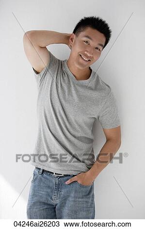 Man leaning casually against a wall View Large Photo Image Stock Image - Man leaning casually against a wall. Fotosearch