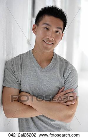 Man leaning on wall, arms folded View Large Photo Image Stock Image - Man leaning on wall, arms folded. Fotosearch