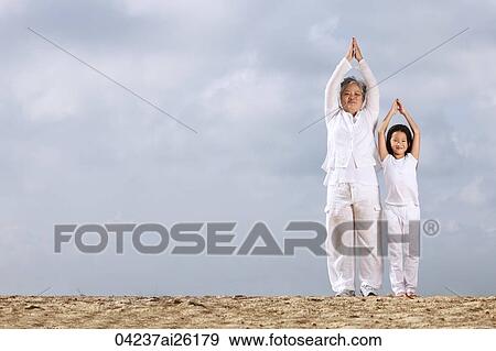 Older woman and young girl exercising. View Large Photo Image Stock Photo - Older woman and young girl exercising.. Fotosearch