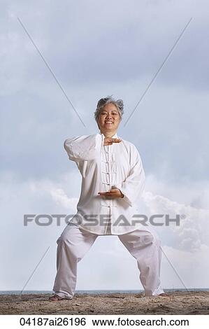 Stock Photograph - Older woman doing martial arts.. Fotosearch