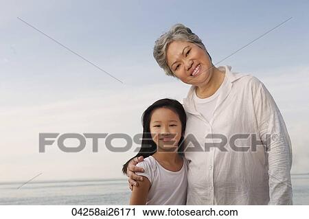 Older woman hugging young woman. View Large Photo Image Stock Image - Older woman hugging young woman.. Fotosearch