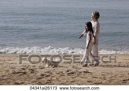 Older woman walking dog with young girl. View Large Photo Image Stock Image - Older woman walking dog with young girl.. Fotosearch